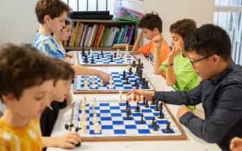 Boys play chess with a clock to control time Vector Image