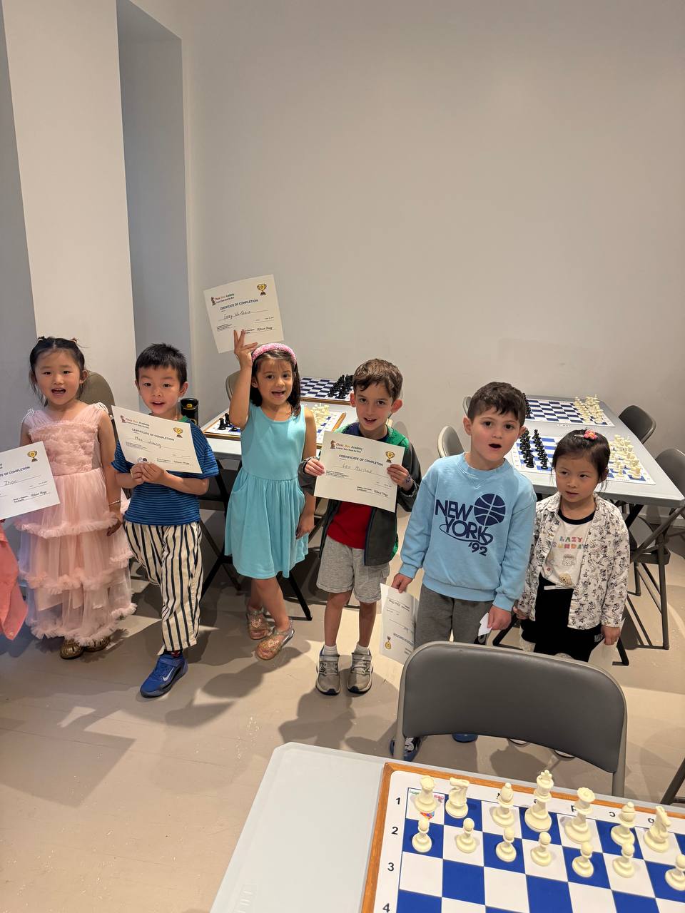 Children practicing chess as a screen-free intellectual activity