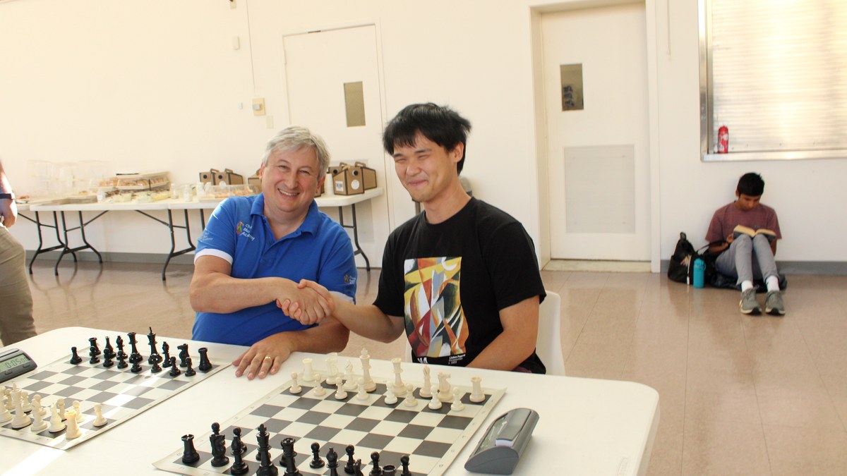 Chess players sharing a handshake after a game