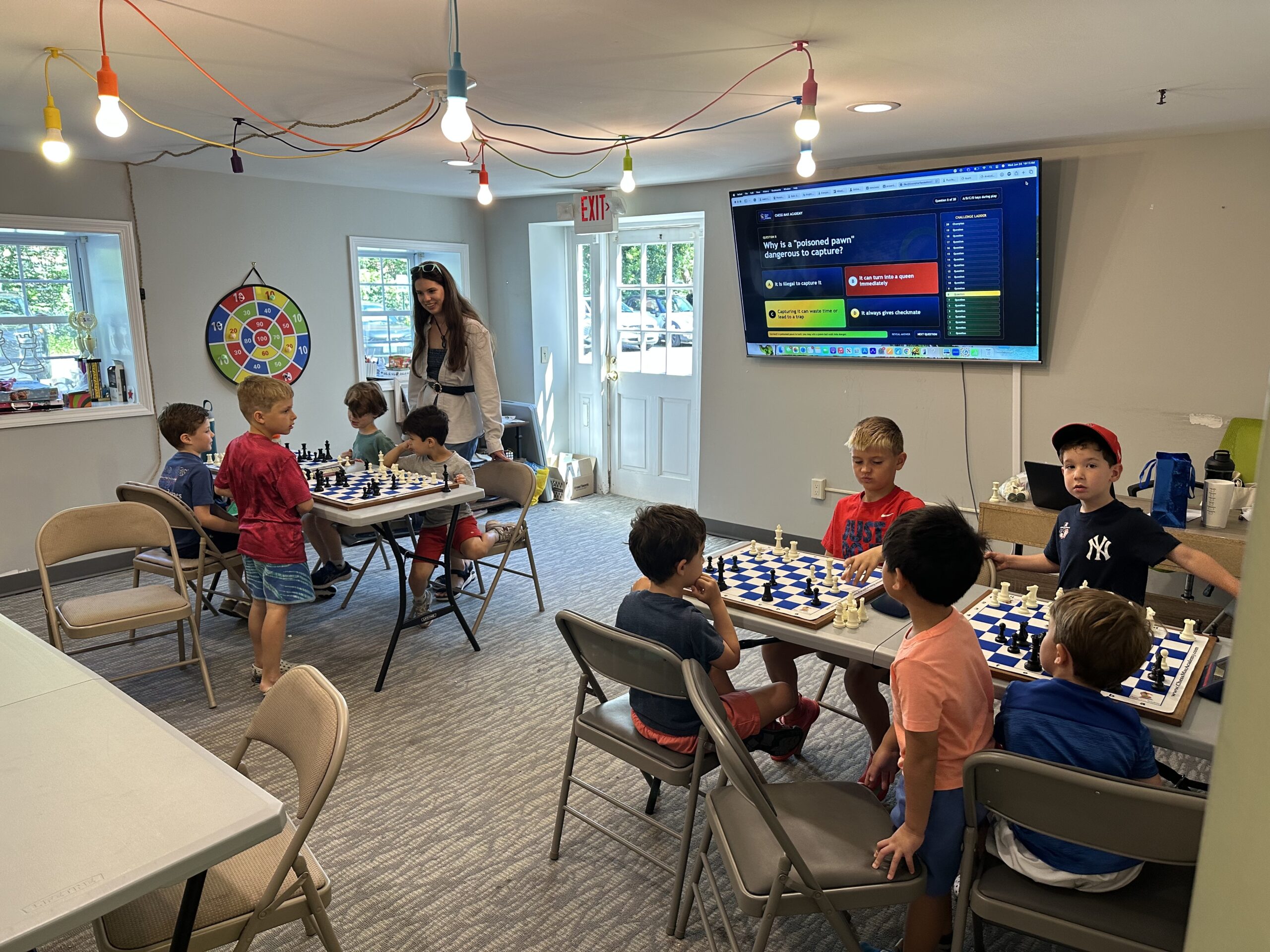 Children playing chess at Chess Max Academy summer camp