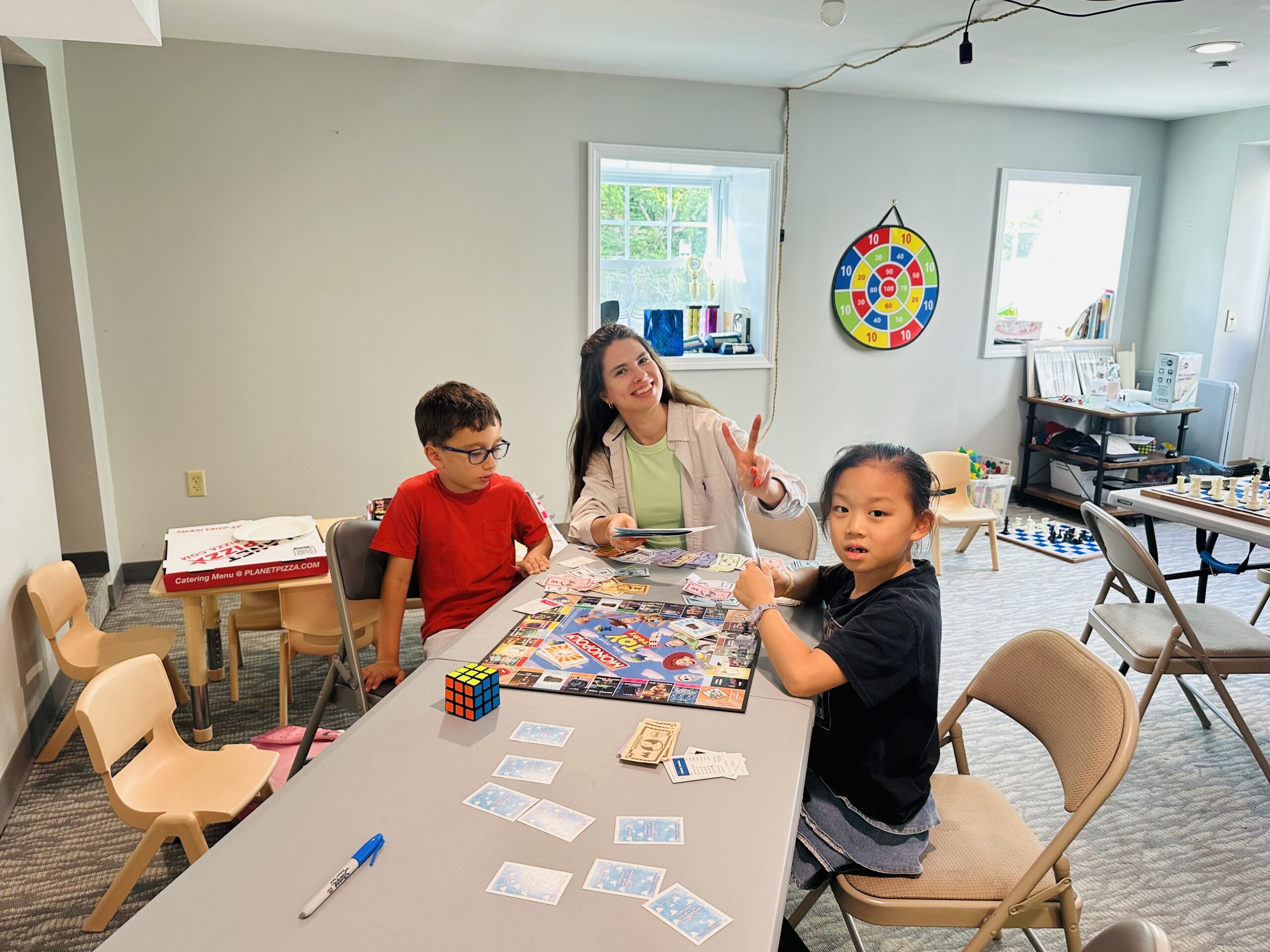 Campers playing a tabletop game during free time