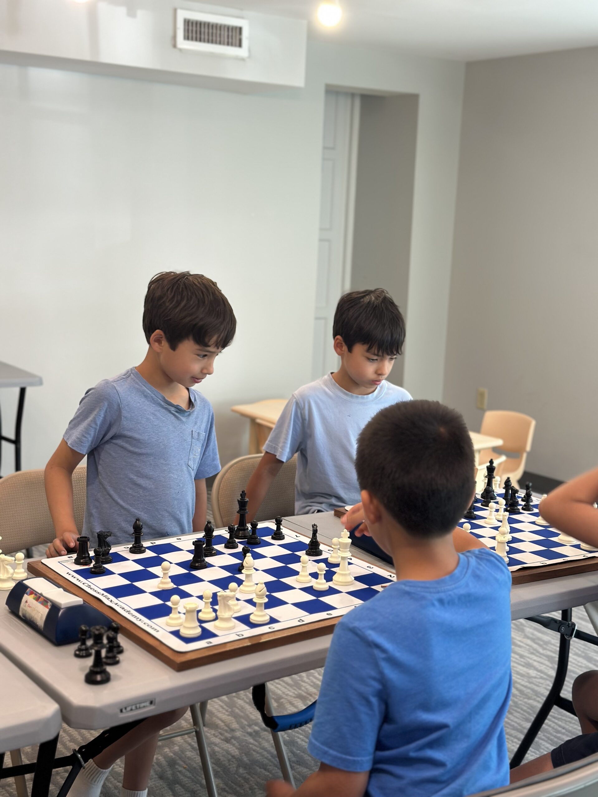 Campers playing peer chess games together
