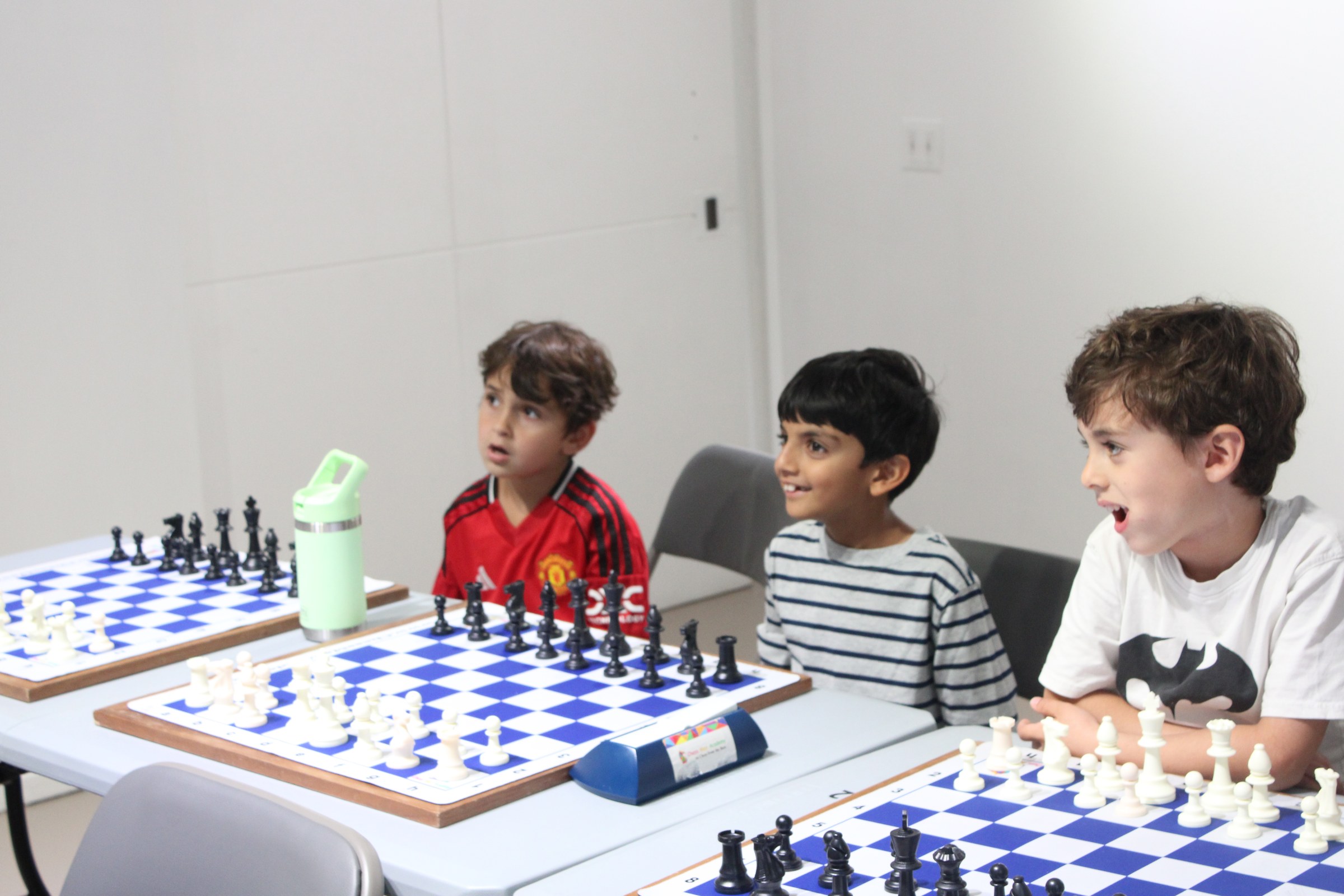 Upper West Side students reacting during a chess lesson at Chess Max Academy