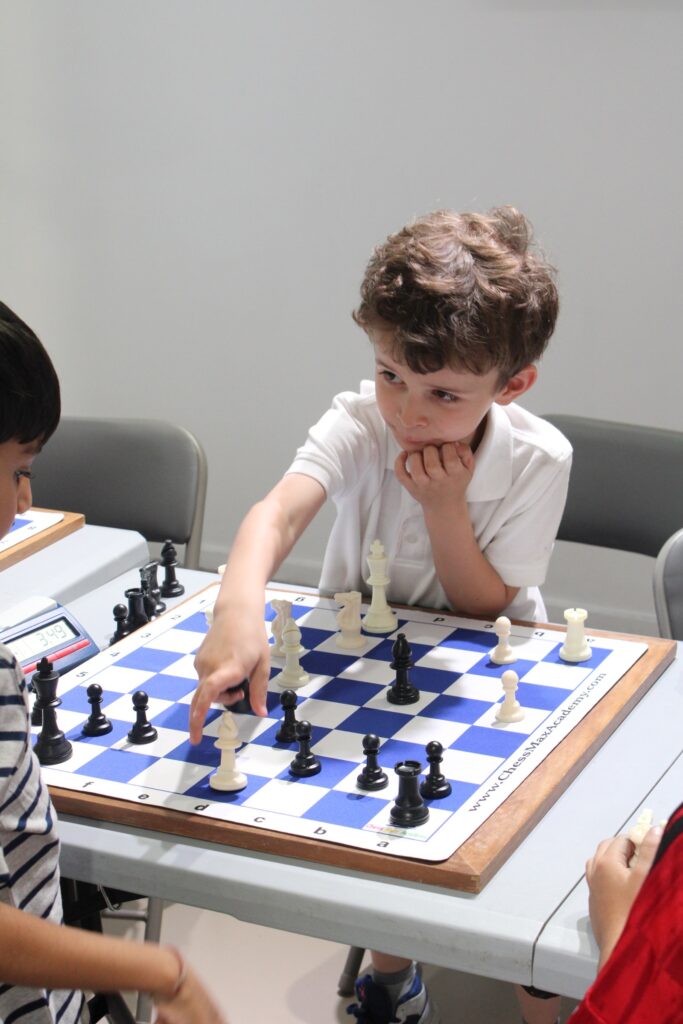 Upper West Side student concentrating on a chess position at Chess Max Academy