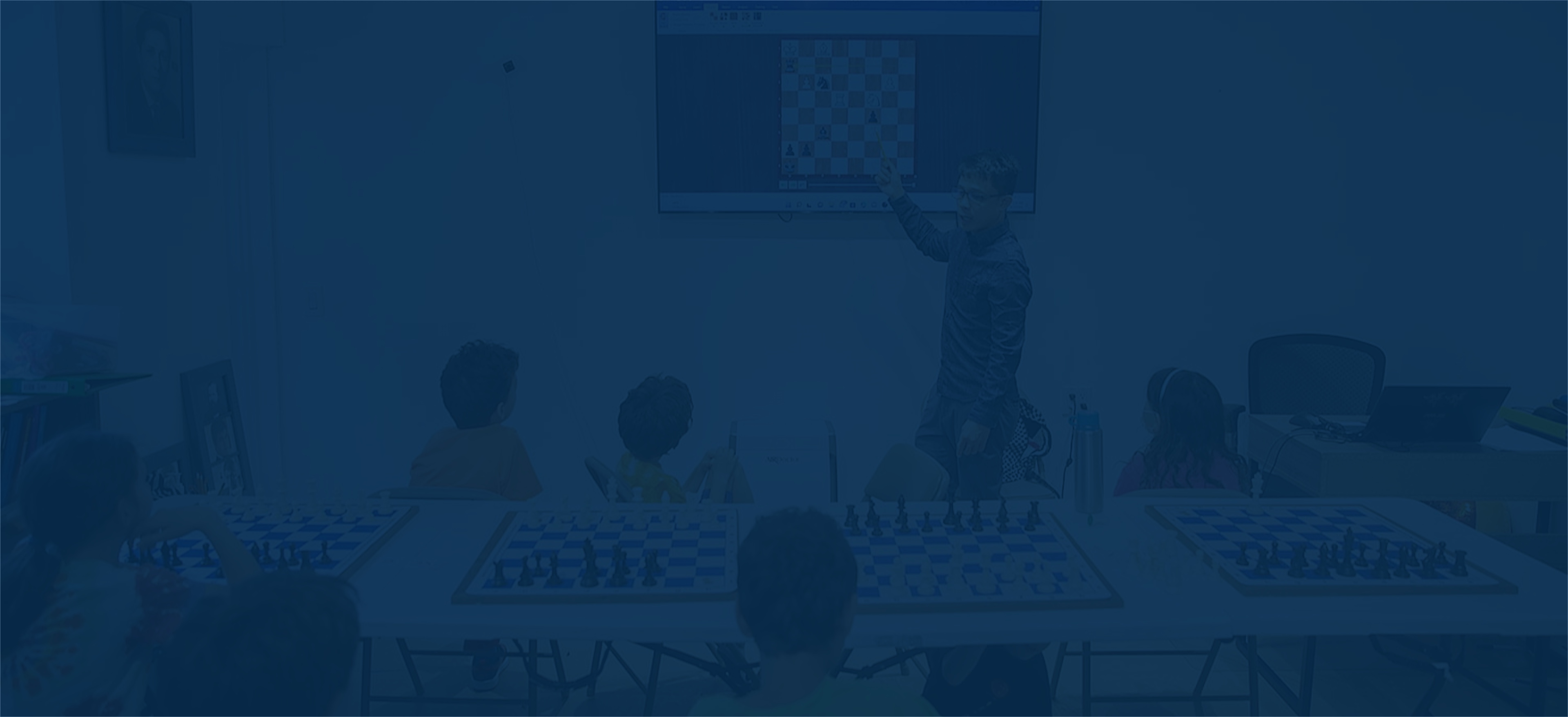 Students learning chess at Chess Max Academy