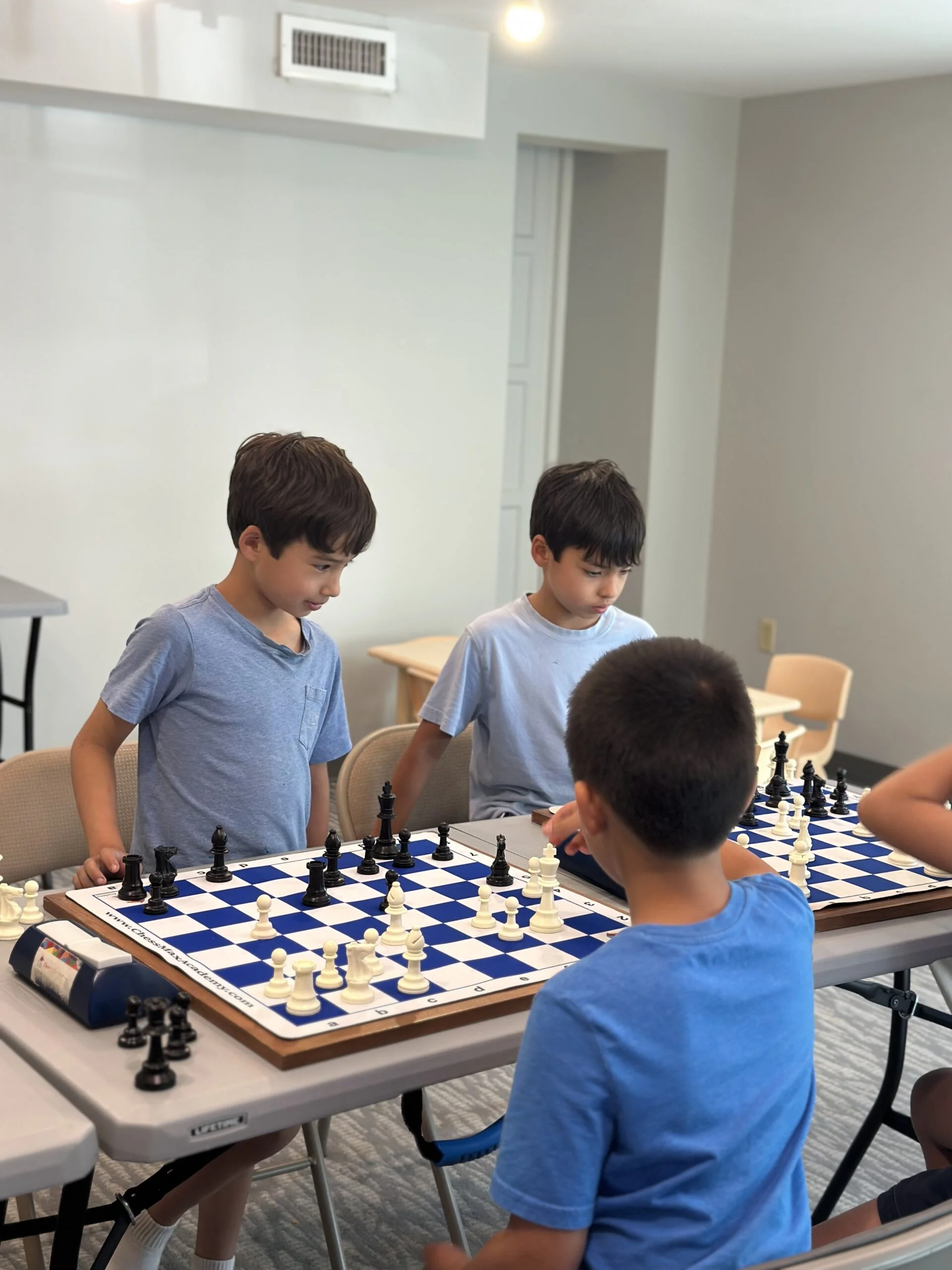 Campers playing peer chess games together