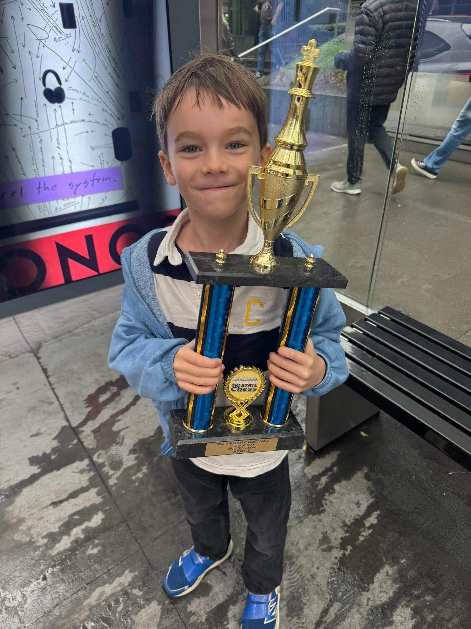 Theo Bellec with a chess trophy